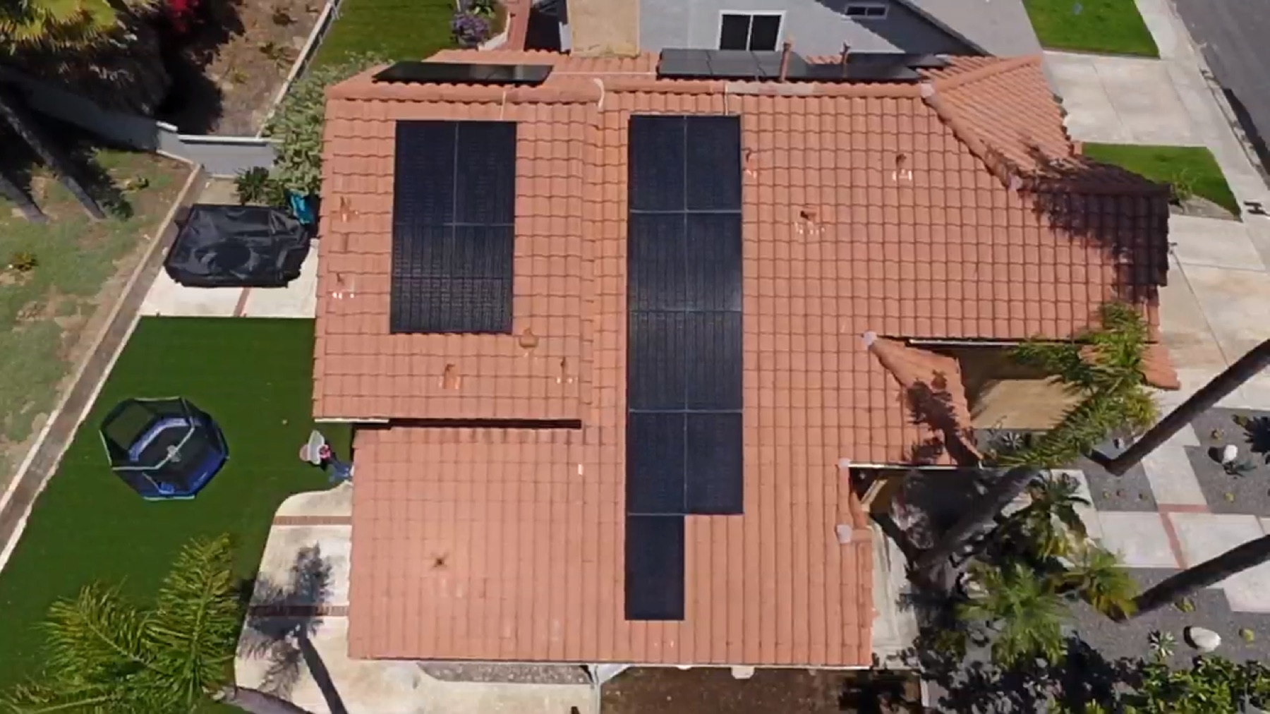 Aerial view of a cleaned roof and solar panels