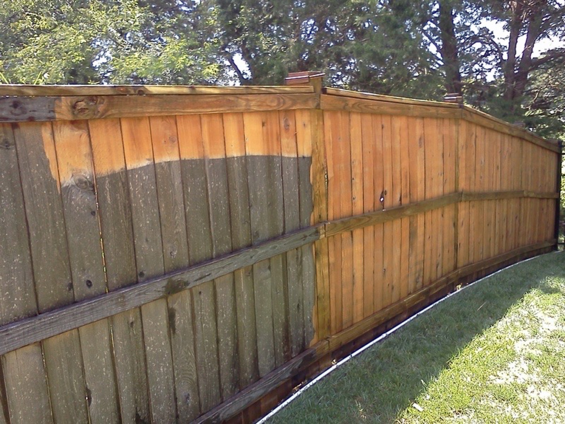 Wood fence before and after cleaning