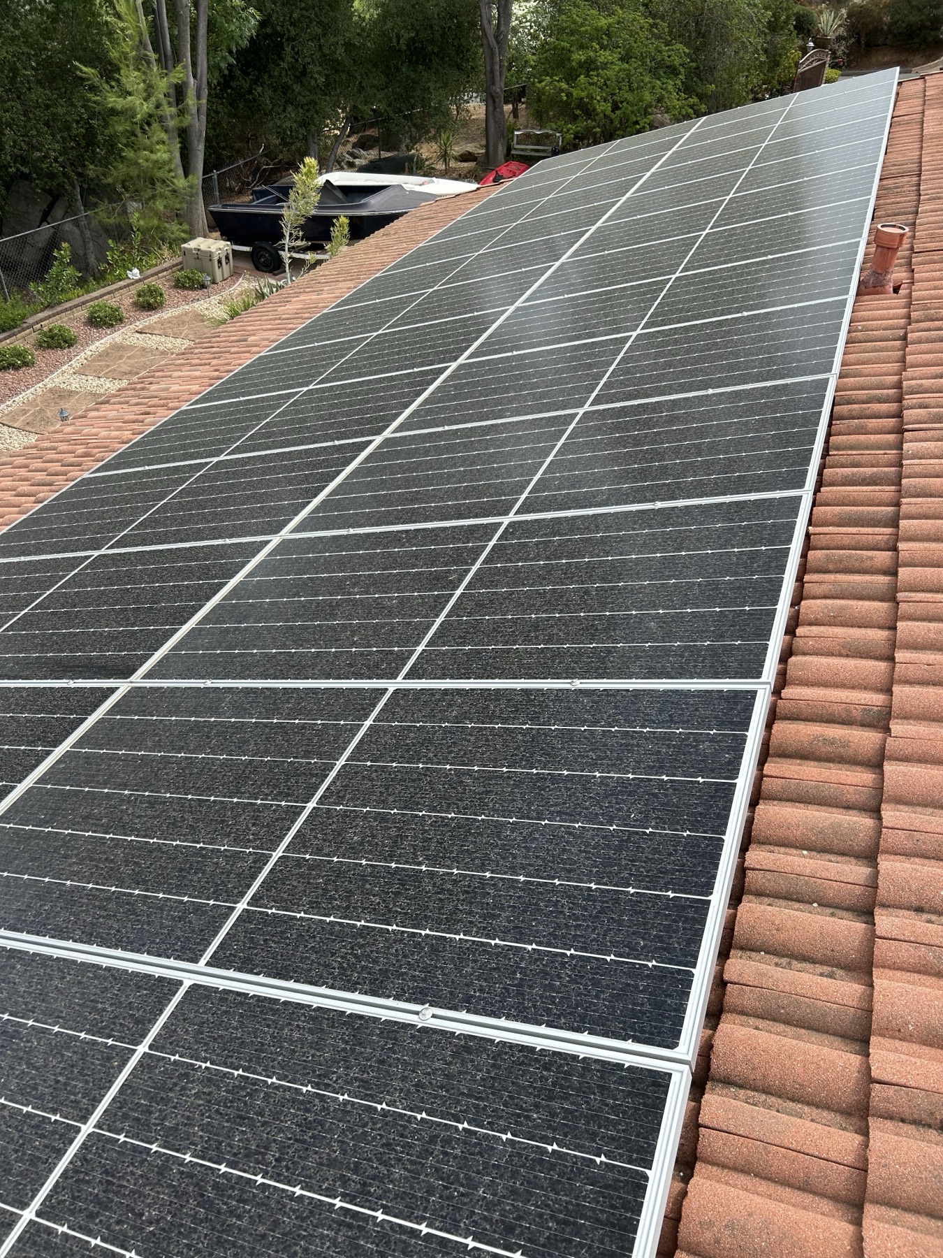 Solar panels mounted on a clean tile roof