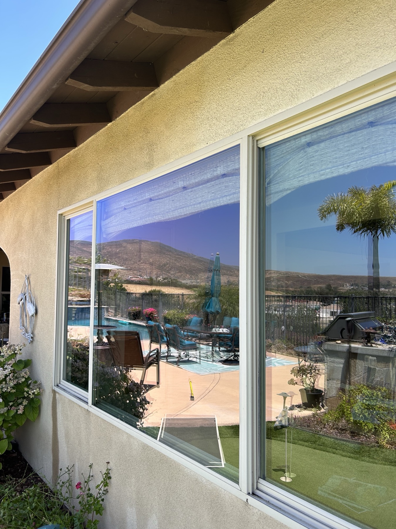 Clean residential window reflecting outdoor light